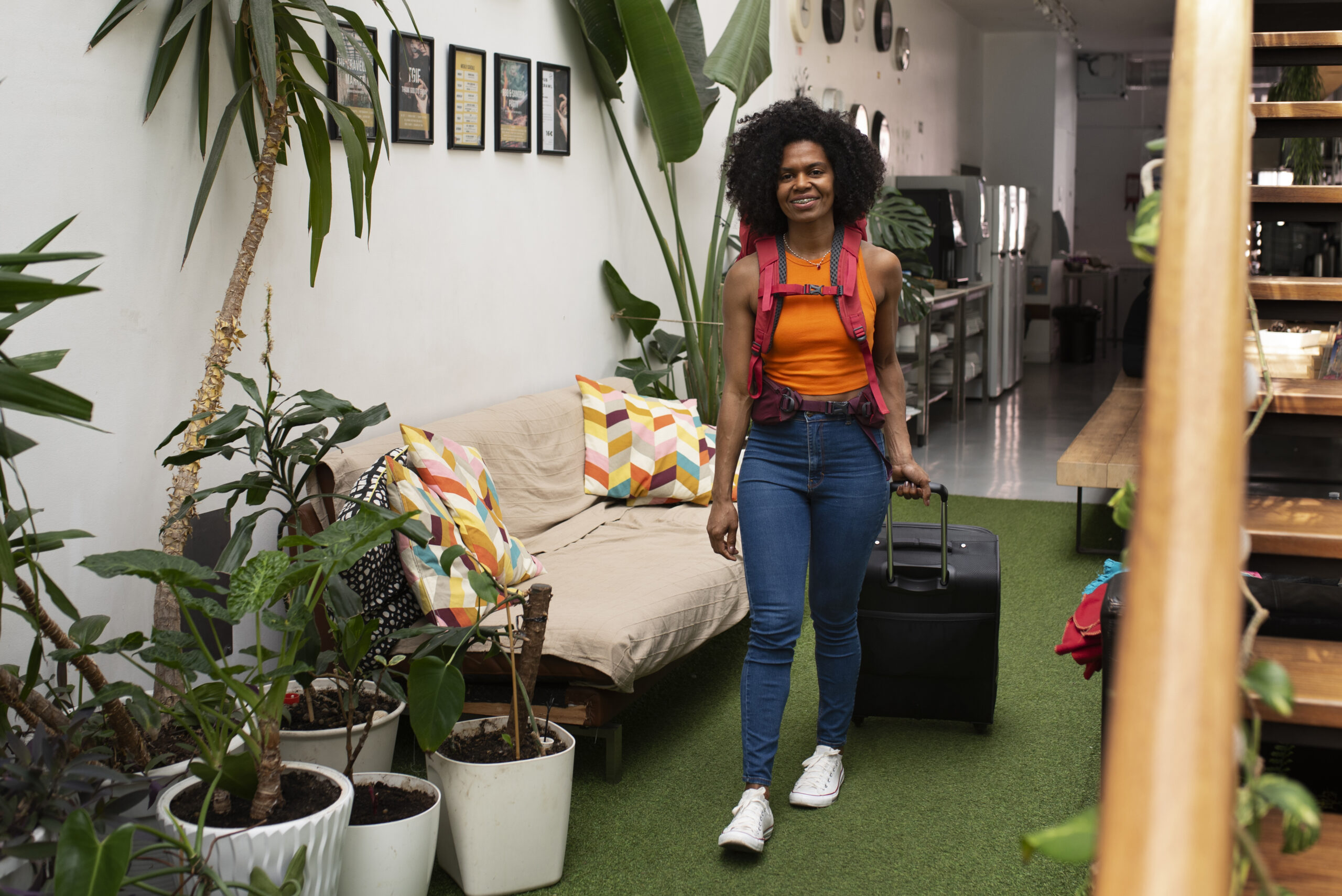 full shot young woman hostel